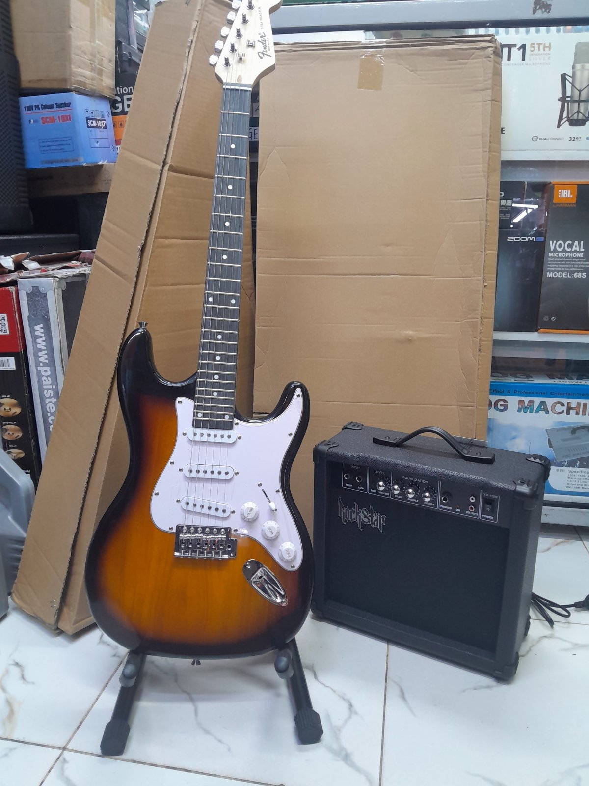 Fender Sunburst Electric Guitar and Rockstar tg10 Amplifier Combo 